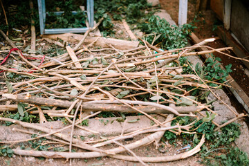 Dry firewood stacked and ready for use, featuring rough, weathered wooden logs perfect for rustic