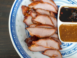 Roast barbecue red pork or Cantonese barbecued pork served with dip sauce
