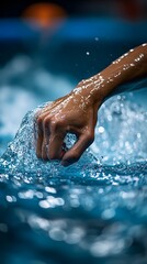 A hand reaching into water, creating ripples and splashes, conveying motion and fluidity.