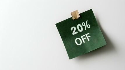 White '20% OFF' Text on a Dark Green Square Paper Note. White Background with Copy Space