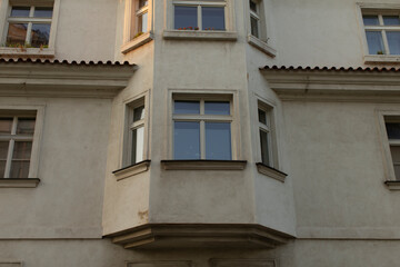 This striking architectural detail showcases a unique and captivating window design on the building facade