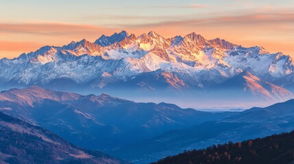The view of the mountains at sunrise, with soft golden light illuminating the peaks and valleys, is a peaceful start to the day.