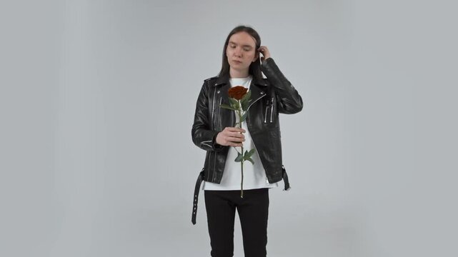 guy with a rose flower in his hands
