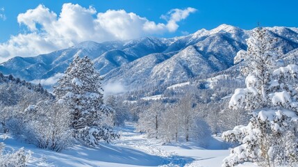 Snow-covered mountain views, with towering peaks beneath a clear blue sky, create a winter scene.