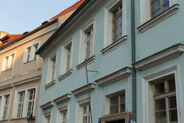 Elegant buildings showcasing classic architectural design with soft pastel hues in a serene urban setting and ambiance