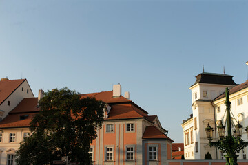 Enjoy stunning views of traditional buildings and a bright sky in a charming European town with picturesque streets