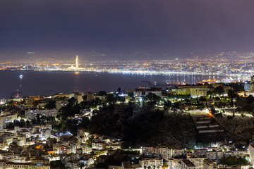 Obraz premium Night view from above of the city of Algiers and Great Mosque of Algiers. Republic of Algeria