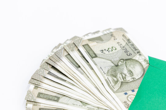 Indian currency 500 rupee bank note on white background, Five hundred Indian rupee bank paper currency note, Group of money stack of 500 Indian Rupee banknote.