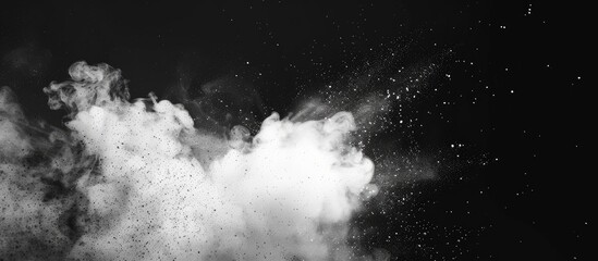 White smoke particles against a black backdrop with copy space image