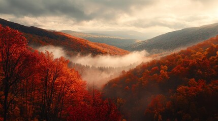 A beautiful mountain view in autumn, with bright red and orange leaves covering the hills and mist rising from the valley.
