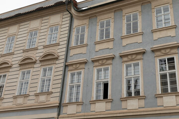 A beautifully detailed and intricate building facade showcasing elegant windows along with classic design elements