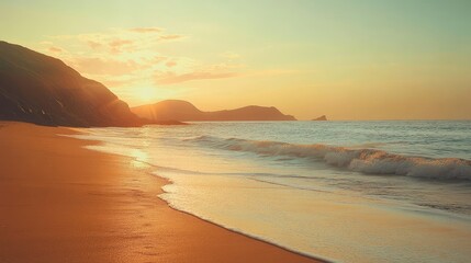 Obraz premium A beach at golden hour with calm waves and warm sunlight illuminating the sky, evoking peacefulness and serenity