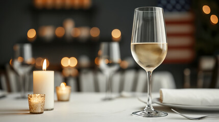 Glass of chilled white wine is standing on a table in a restaurant, illuminated by warm candlelight, creating a cozy and inviting atmosphere