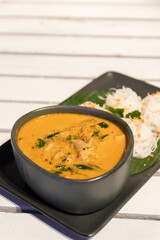 Crab and betel leaf curry. Thai Southern-style crab yellow curry with betel leaves and garlic rice noodles.
