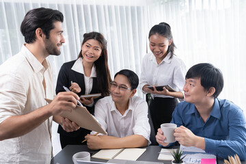 Group of diverse office worker employee working together on strategic business marketing planning in corporate office room. Positive teamwork in business workplace concept. Prudent