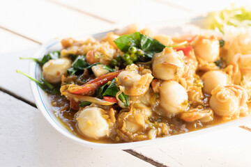 Delicious seafood dish featuring fresh ingredients in a savory sauce, perfect for food lovers and culinary enthusiasts.