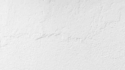 The wall is painted with white paint with a visible texture