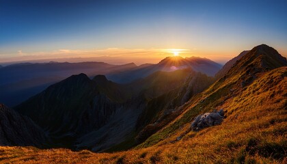 early dawn in the mountains the sun just came from behind the top of the mountain