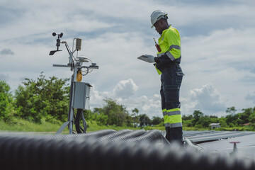 African-American engineer carefully examines cutting-edge floating solar panel system designed to harness renewable energy for complex industries