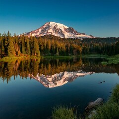 Fototapeta premium symmetrical mt rainier and reflection lake at sunrise