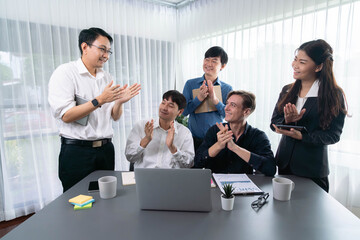 Excited and happy office worker employee celebrate after make successful strategic business marketing planning. Teamwork and positive attitude create productive and supportive workplace. Prudent