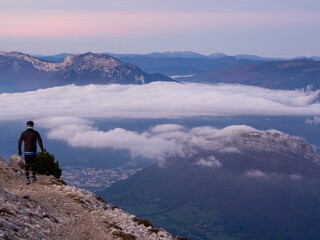 Hiker Silhouetted Against a Vercors Panorama and Sea of Clouds