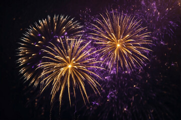 Gold and dark violet fireworks light up the night sky for New Year's