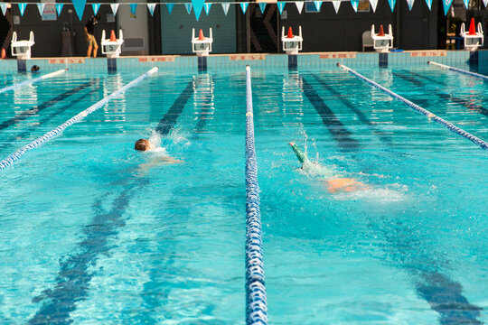 kids practicing their swimming at the local pool