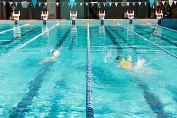 kids swimming in the lanes of an outdoor 25 metre pool