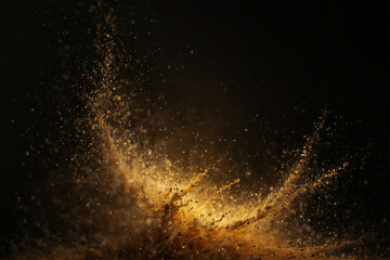 Golden dust explodes against a black background