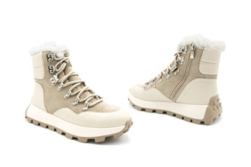 Fashionable leather with suede inserts lace-up boots with fur isolated on white background. View from all sides.	