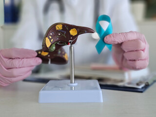 Doctor with green ribbon and liver