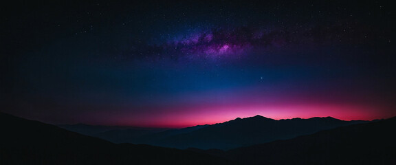 Fototapeta premium A silhouette of a mountain range against a vibrant purple and pink sky