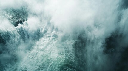 Obraz premium Top view of the Niagara Falls with mist rising, leaving space for text in the sky