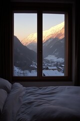 Fototapeta premium Cozy bedroom offering stunning view of snow capped mountain range at sunset