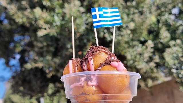 Fototapeta sweet loukouma or loukoumades greek flag street food sweet