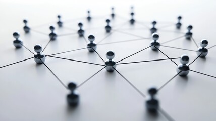 Silver spheres interconnected on white surface representing network connections