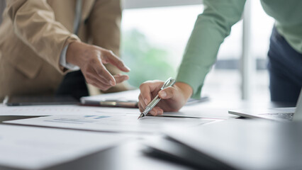 Alternative energy environment businesspeople checking document and discuss about renewable energy