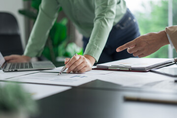 Alternative energy environment businesspeople checking document and brainstorm about future power