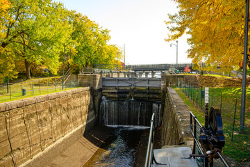 The Rideau Canal at Hog’s Back Park in Ottawa a popular year round destination with locals and visitors seen here in fall color room for text	