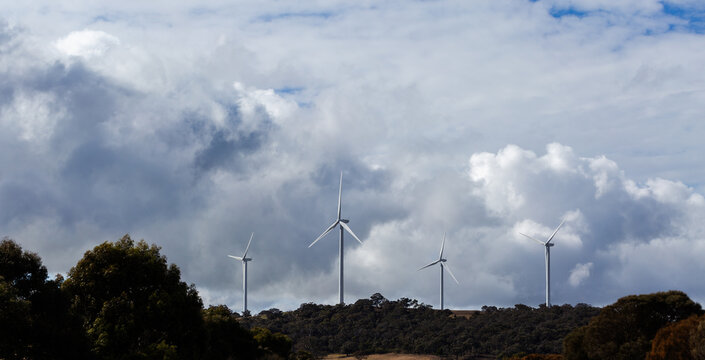 View through car windscreen of wind turbines on horizon sustainable green technology