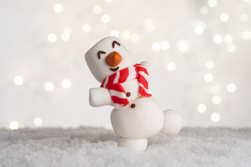 Happy funny marshmallow snowmans on snow