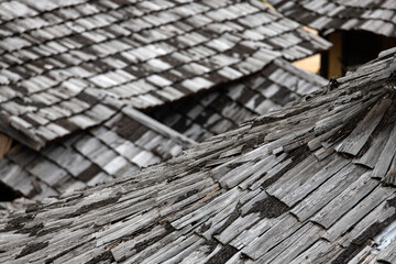 old roof covered with the wooden tiles