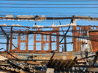 Burnt wooden house destroyed by fire, resulting in damage and ruins