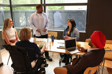 Diverse group of business people discussing in office