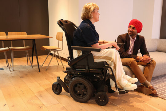 Businessman discussing with businesswoman in office
