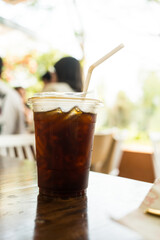 Closeup of take away plastic cup of iced americano