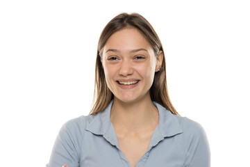 Portrait of a beautiful young happy woman without makeup on a white studio background