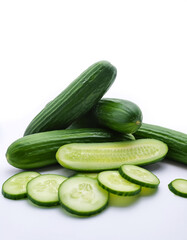 cucumber whole and sliced scattered around background concept isolated white