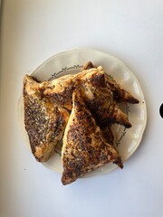puff pastry pierogies with pumpkin filing and seed topping in sunlight